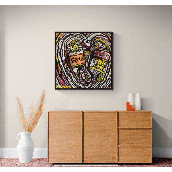 A Hearts Soup Framed Print on a wall above a dresser.