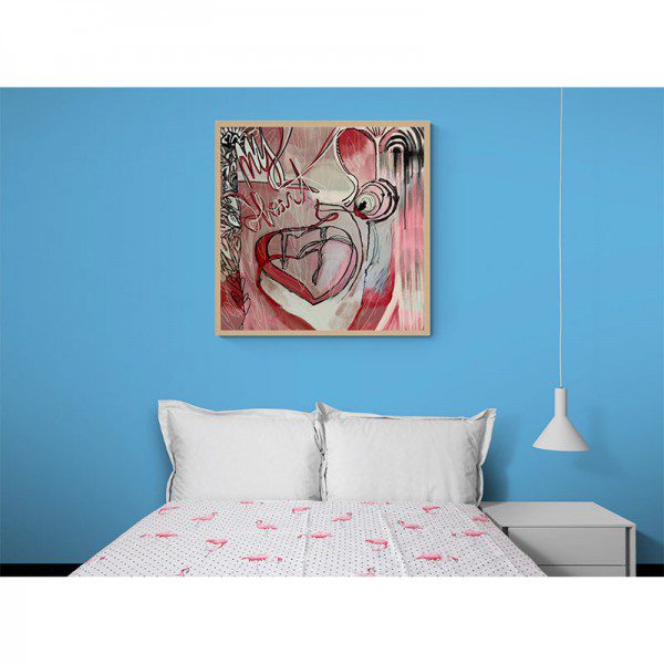 A bedroom with a bed and a My Heart Print on the wall.