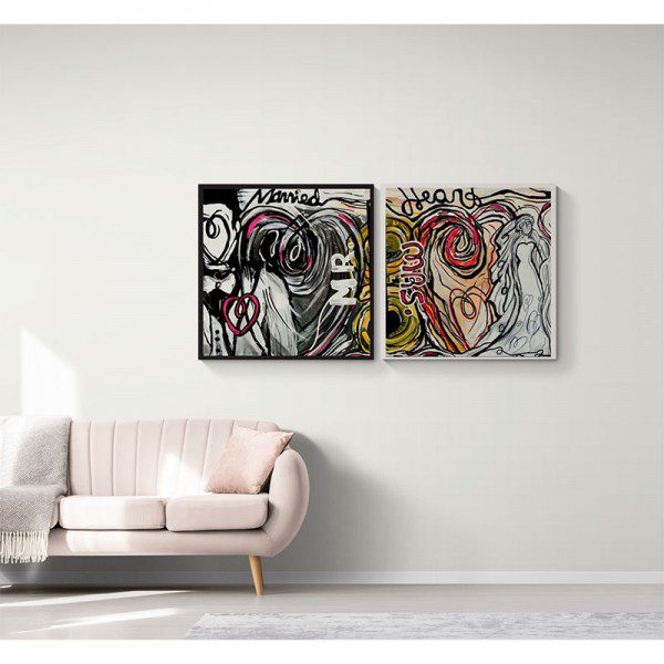 Two Phoenix Heart Prints hanging on a wall in a living room.