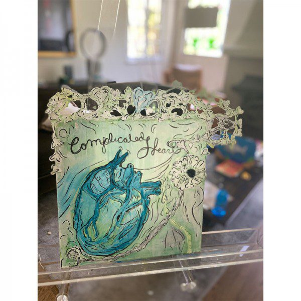 A piece of art with the words 'Complicated Heart' on it.