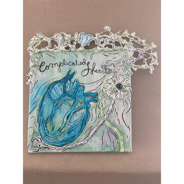 A ceramic plaque with the words Complicated Heart on it.
