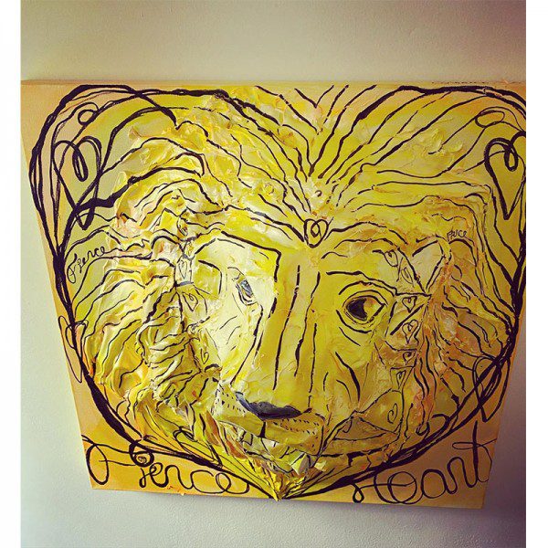 A drawing of a lion on a wall.