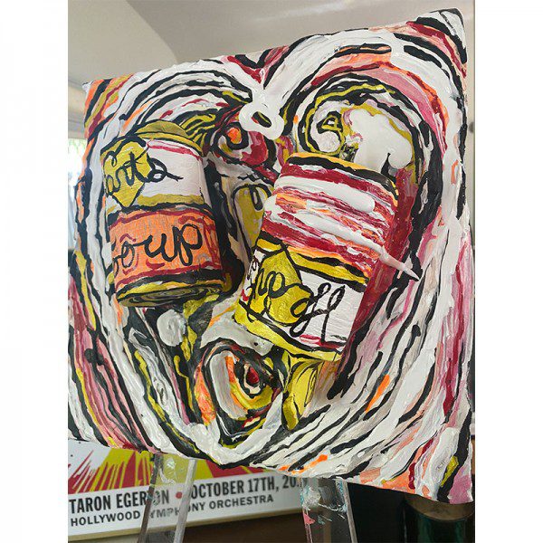A painting of a can of Hearts Soup on an easel.