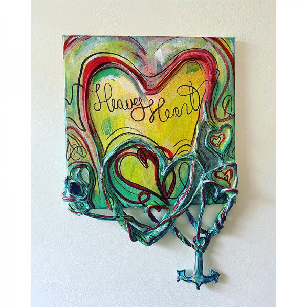 A painting of a Heavy Heart with the words 'happy heart'.