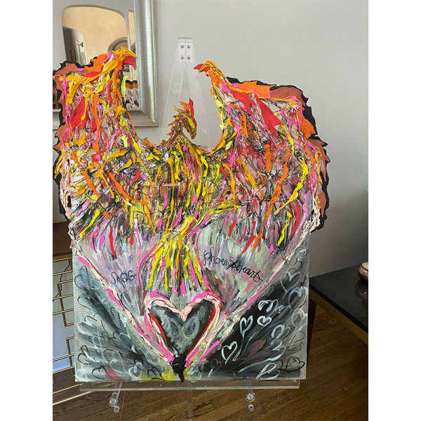 A painting of a Heavy Heart on display in a room.