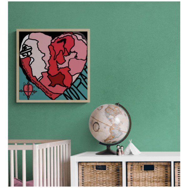 A baby's room with a Map Heart Framed Custom Print with baby name and state of birth silhouette on the wall.